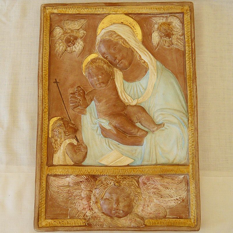 Madonna con bambino e testa di angelo con manto celeste
